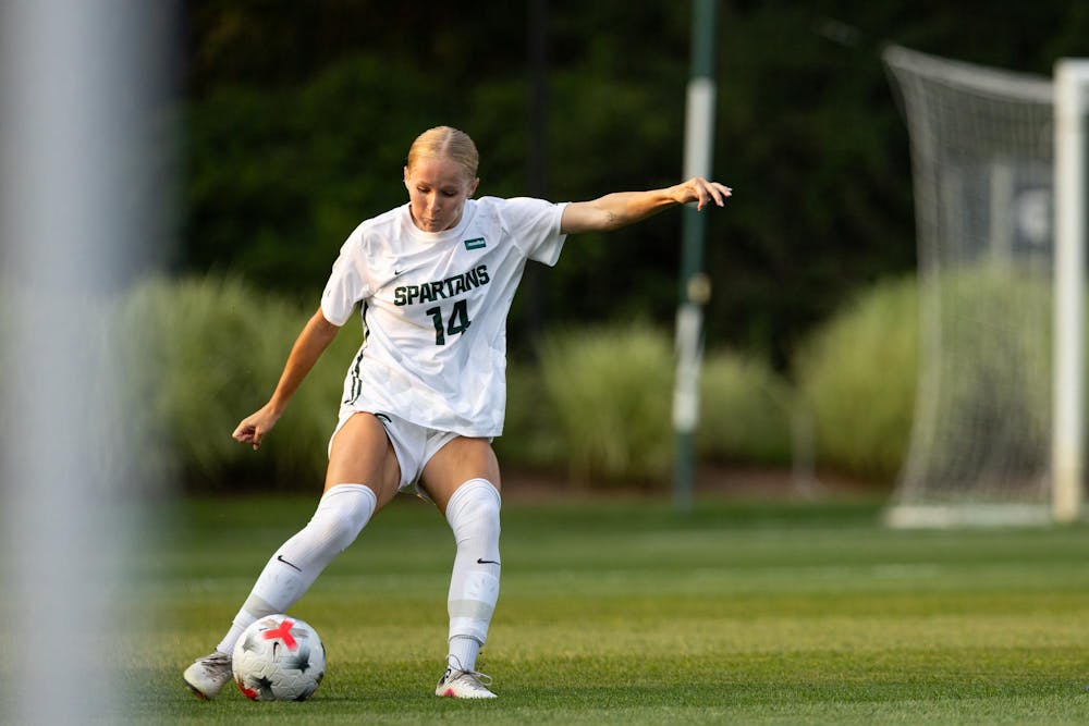 <p>Michigan State Jr. D, Faith George (14), kicks the ball up the field to her teammates in DeMartin Stadium in East Lansing, Mich., on Aug. 12, 2026.</p>