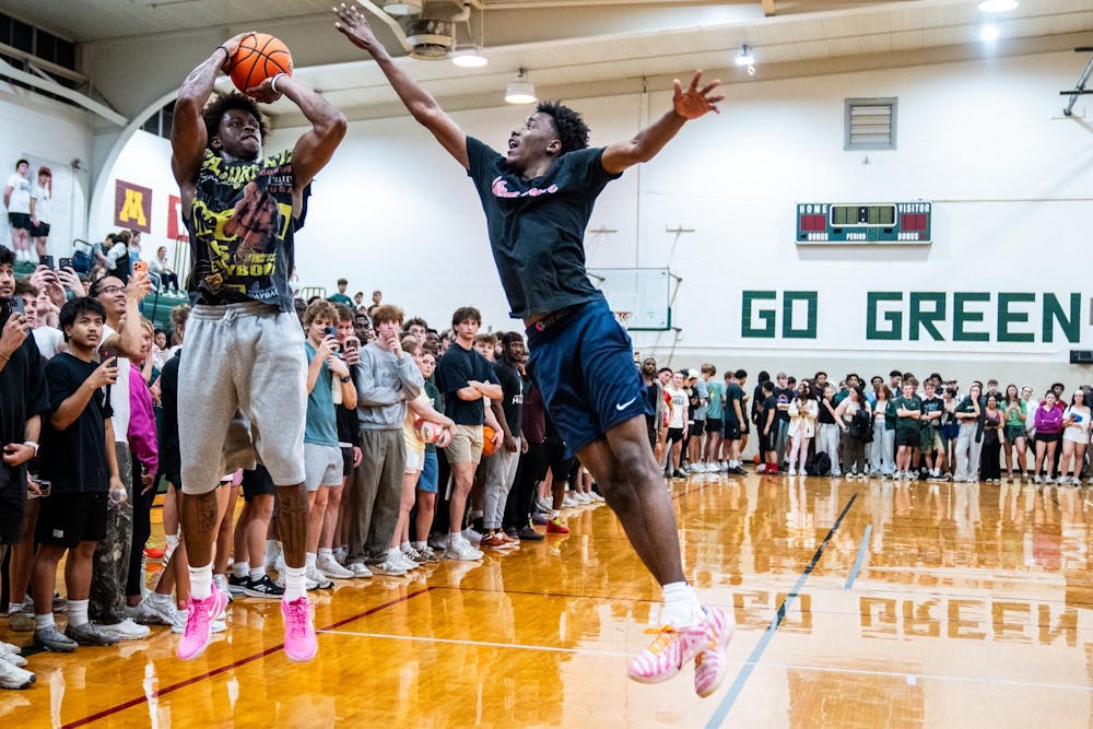 Michigan State junior forward Coen Carr shoots over a student during pickup basketball at IM West Fitness Center on Michigan State University’s campus in East Lansing, Mich., on Tuesday, March 31, 2026.