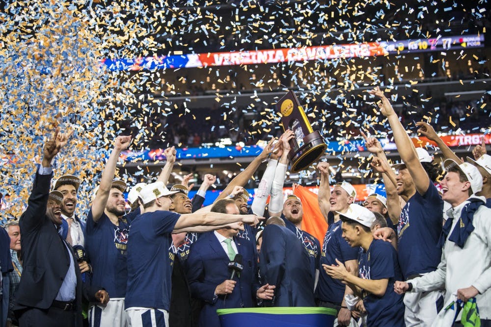 Virginia players celebrate their win in the NCAA Tournament Championship game against Texas Tech at U.S. Bank Stadium in Minneapolis on April 8, 2019. Virginia defeated Texas Tech in overtime 85-77. (Nic Antaya/The State News)