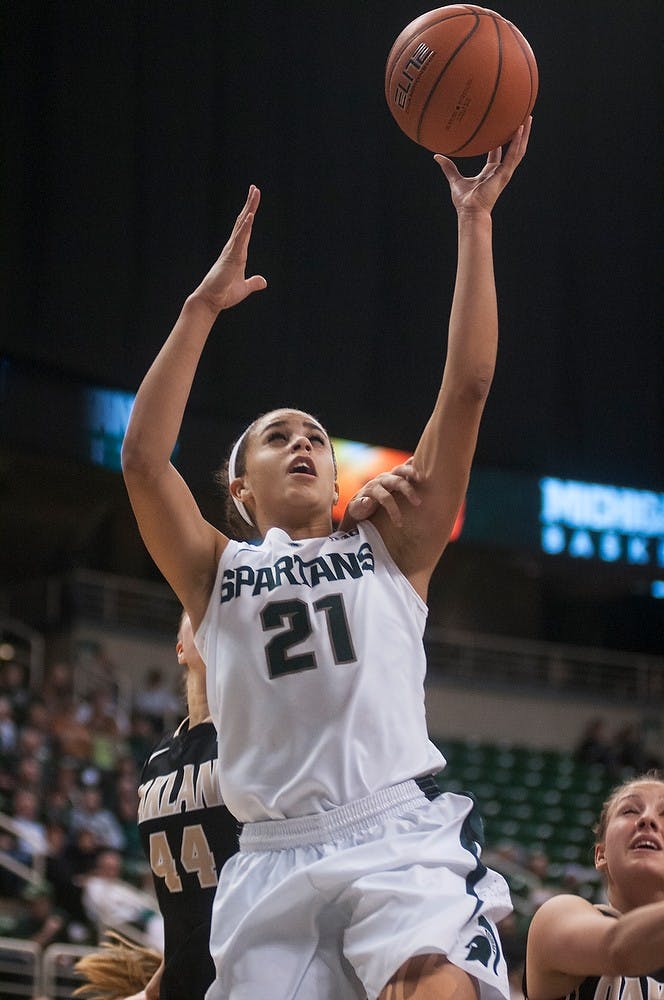 	<p>Senior guard Klarissa Bell goes up for a shot during the game against Oakland on Dec. 15, 2013, at Breslin Center. The Spartans defeated the Grizzlies, 80-62. Danyelle Morrow/The State News</p>