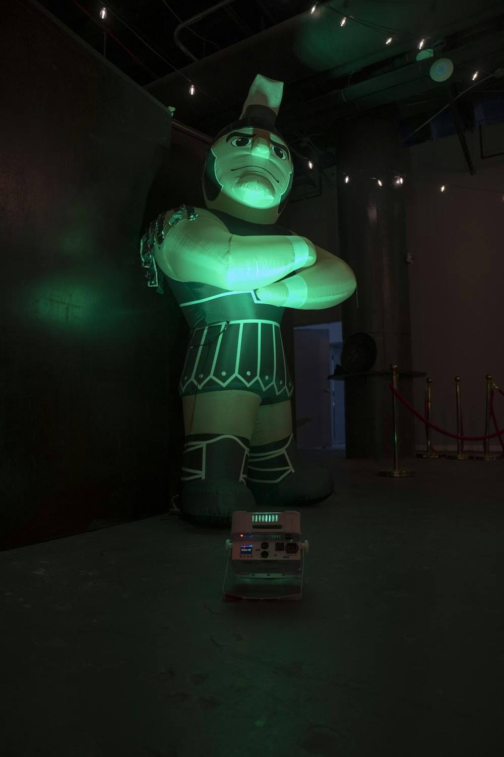 An inflatable Sparty is lit by a green light at a Michigan State men's basketball watch party in Atlanta on March 28, 2025.