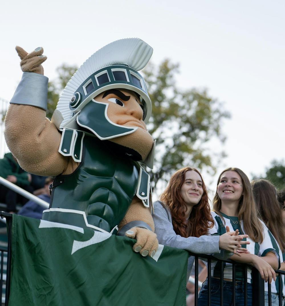 <p>Sparty dances to music as he stands along side members of the Red Cedar Rowdies at DeMartin Stadium in East Lansing, Mich., on Thursday, Sept. 24, 2026.</p>