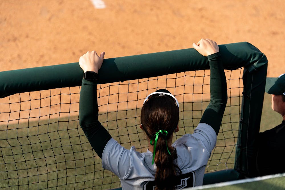 MSU softball player looking onto the game during the MSU V Nebraska Softball game at Secchia Stadium in East Lansing, on March 20 2026.