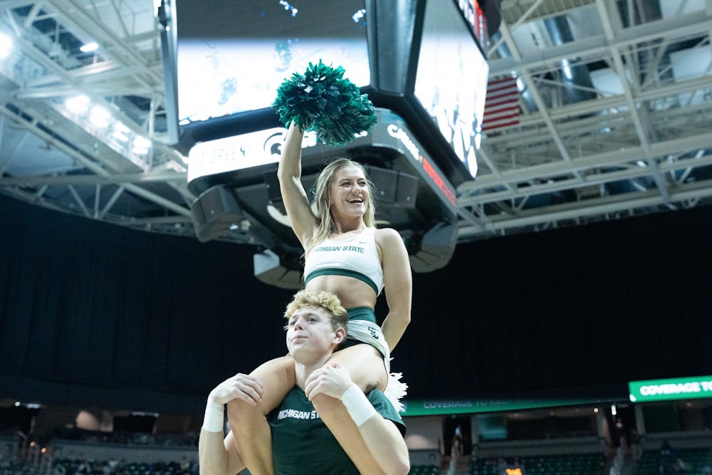 <p>MSU Cheer Team at the Western Michigan vs. MSU game held at the Breslin Center on November 13. The Spartans defeated the Broncos 97-49.</p>