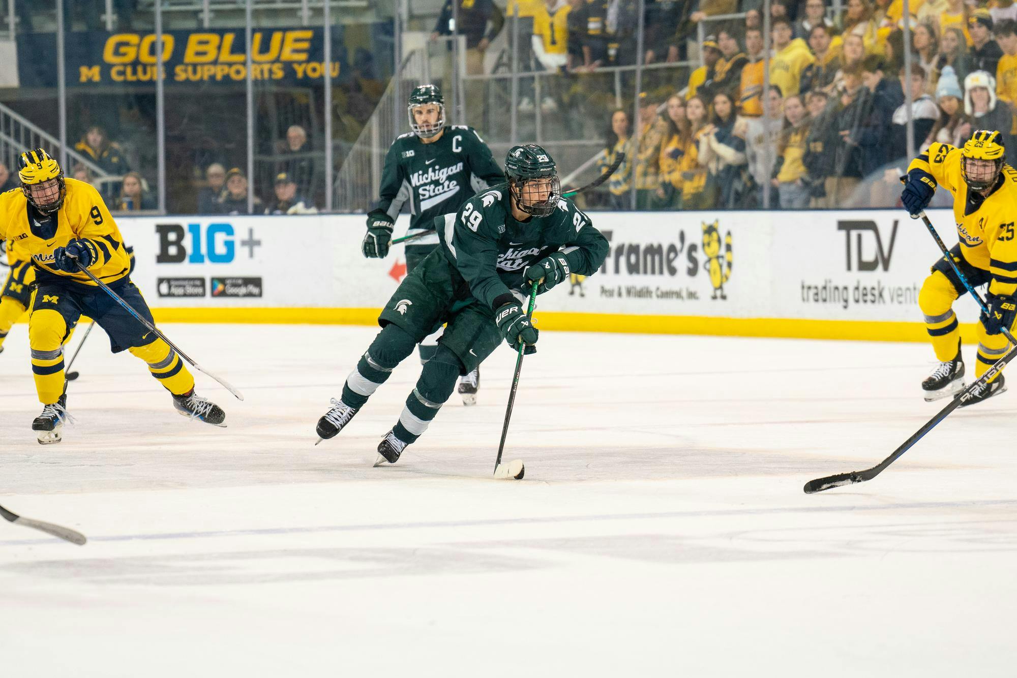 <p>Freshman forward Gavin O'Connell (29) carrying the puck forward during a game against University of Michigan at Yost Ice Arena on Jan. 20, 2024. O’Connell scored one goal in the second period, adding to his tally of 10 goals on the season.</p>