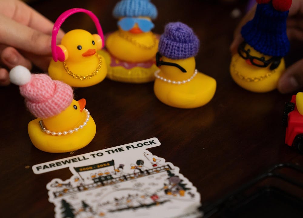 Students play with their rubber ducks at the student union during the Alcohol and Other Drugs Program's Farewell to the Flock event on Dec. 2, 2024.