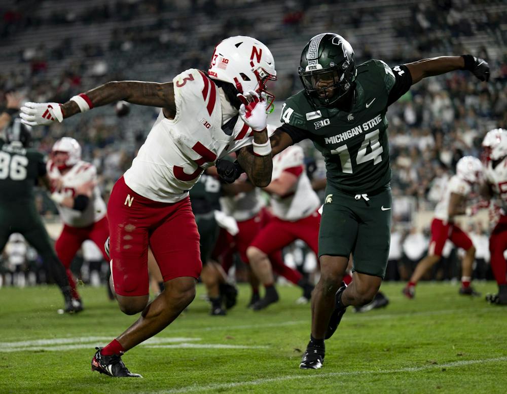 <p>Michigan State sophomore defensive back Andrew Brinson IV (14) covers Nebraska junior wide receiver Kwazi Gilmer (3) downfield during the Spartans’ game against Nebraska at Spartan Stadium in East Lansing, Mich., on Saturday, Sept. 26, 2026.</p>