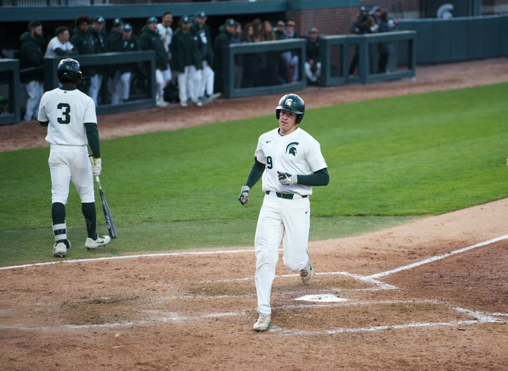 Michigan State redshirt freshman catcher Bryan Broecker (19) reaching home, scoring another run after a wild pitch in the bottom of the fifth. Michigan State won 7-4 against Purdue Fort Wayne at the McLane Stadium, on Apr. 27, 2022.