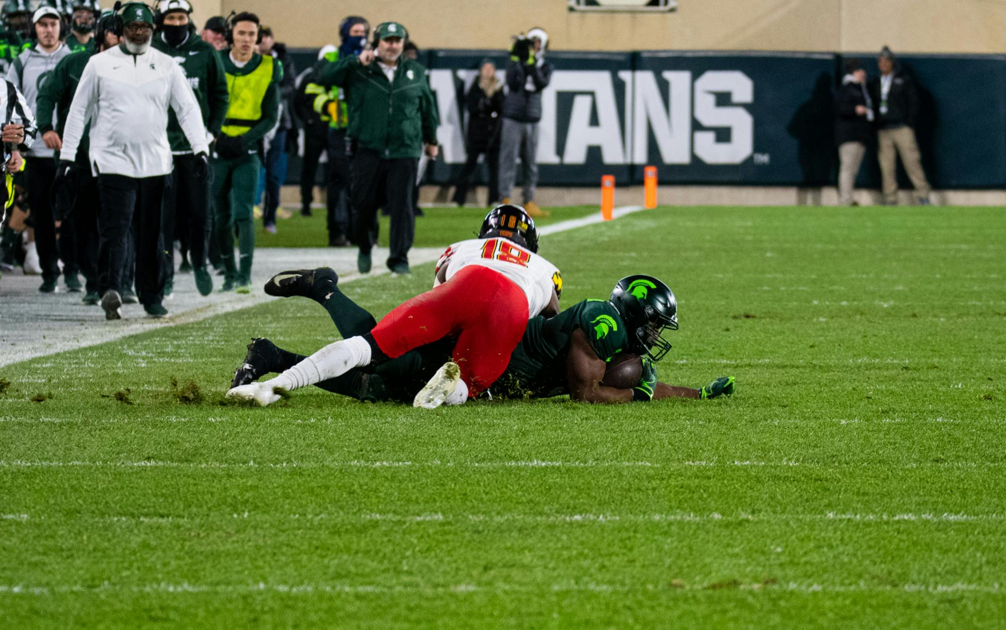 <p>Michigan State&#x27;s junior running back Kenneth Walker III (9) is tackled by Maryland&#x27;s senior defensive back Jordan Mosley (18) on Nov. 13, 2021.</p>