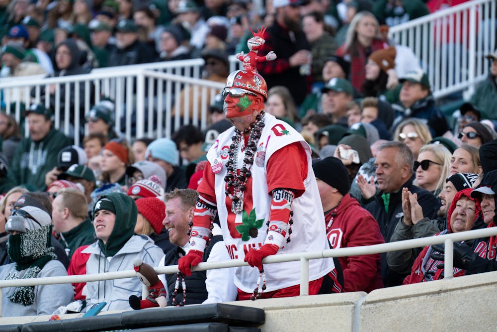 <p>A Buckeyes fan sports his team colors of red and white during the match on Oct. 8, 2022.﻿</p>