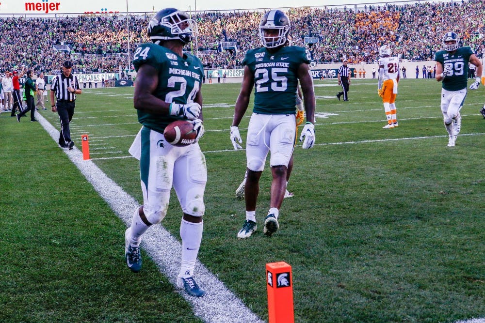 <p>Redshirt freshman Elijah Collins (24) celebrates a touchdown during the game against Arizona State on Sept. 14, 2019 at Spartan Stadium. The Spartans fell to the Sun Devils, 10-7.</p>