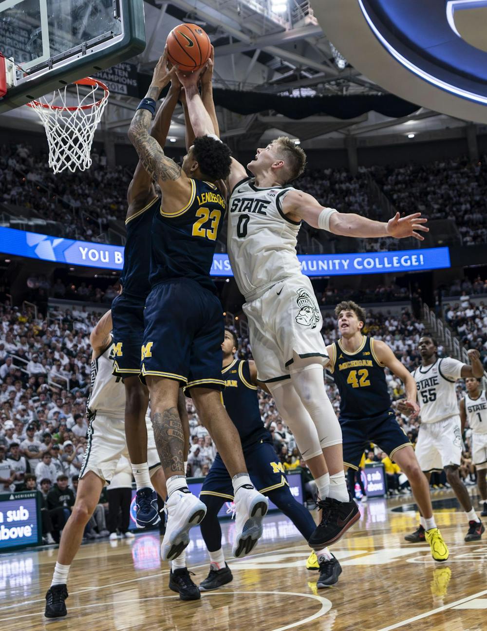 <p>MSU senior forward Jaxon Kohler (0) and UM graduate student forward Yaxel Lendeborg (23) jump for the ball at the Breslin Student Events Center on Jan. 30, 2026.</p>