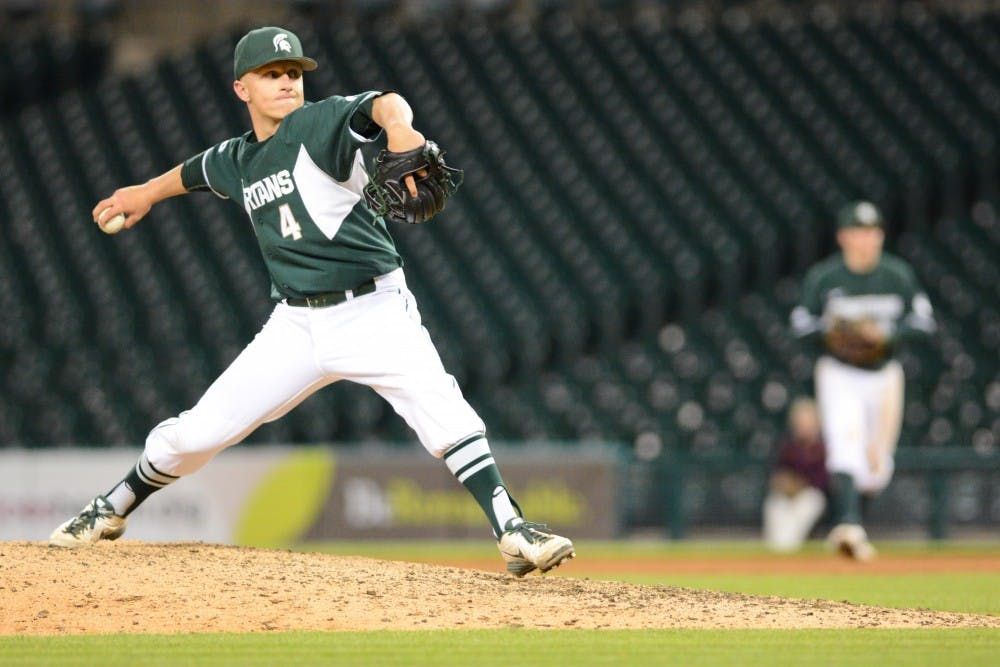 <p>Freshman infielder Riley McCauley pitches the ball during the game against Central Michigan on April 14, 2016 at Comerica Park in Detroit. The Spartans defeated the Chips, 7-3.&nbsp;</p>