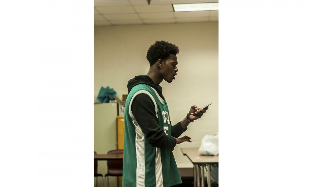 <p>Journalism sophomore Hakeem Weatherspoon performs his poetry during the talent show on March 16, 2016 at Hubbard Hall. Weatherspoon won first place at the talent show that was put on by the staff for Hubbard residents.</p>