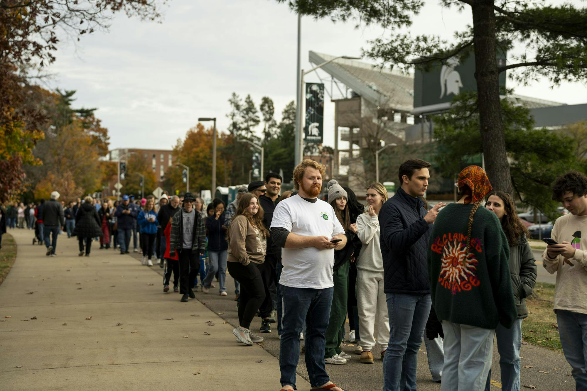 Hundreds of Kamala Harris supporters line up outside of the Jenison Field House at Michigan State University to see her speak just two days before the presidential election on Nov. 3, 2024. The line spanned over half a mile from the Kellogg Center parking ramp to the Spartan Stadium. 