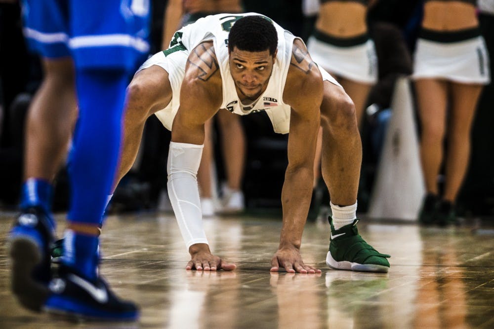 Sophomore forward and guard Miles Bridges (22) slaps the ground during the Championship Classic during the game against Duke on Nov. 14, 2017 at the United Center. The Spartans were defeated by the Blue Devils, 81-88. 