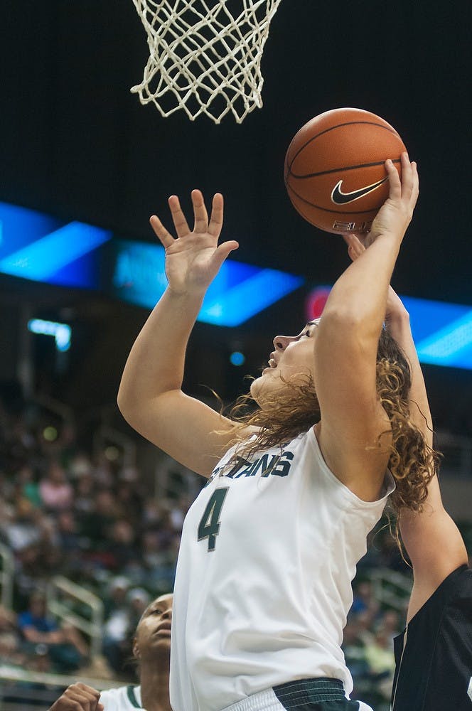 	<p>Junior center Jasmine Hines goes up with a rebound during the game against Oakland on Dec. 15, 2013, at Breslin Center. The Spartans defeated the Grizzlies, 80-62. Danyelle Morrow/The State News</p>