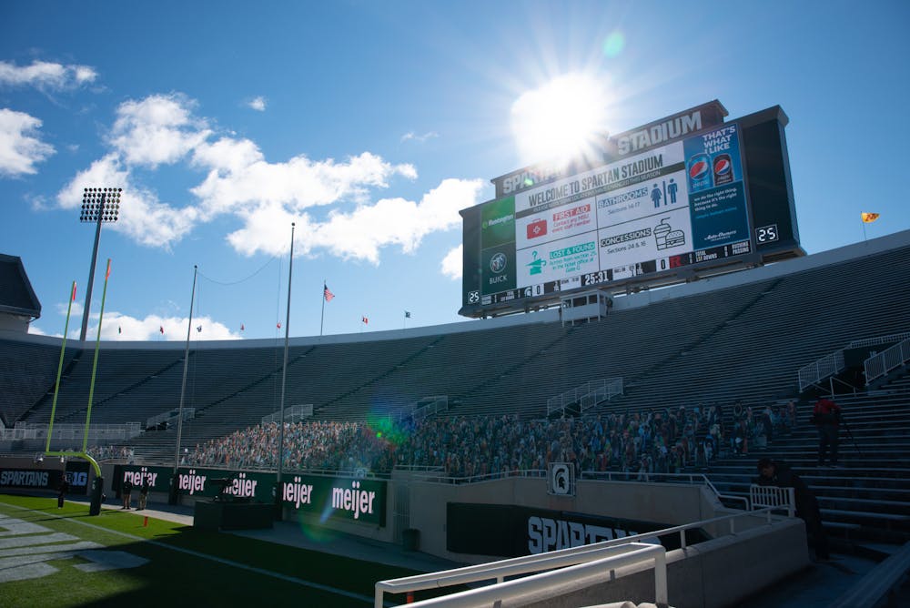MSU stadium houses the first Spartan football game of the season on Oct. 24, 2020. Cardboard cutouts of fans seen in the stands.