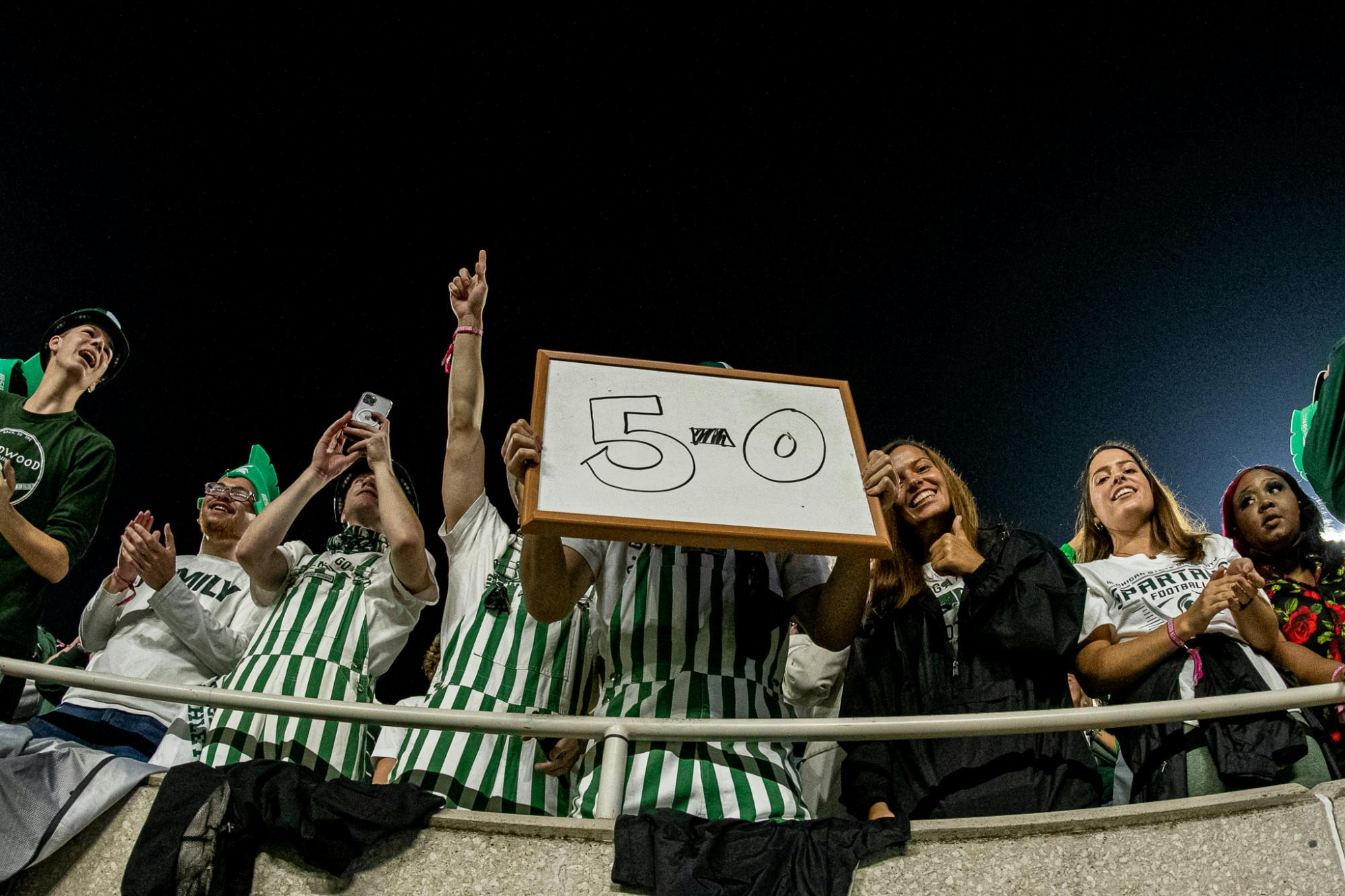 <p>Michigan State&#x27;s student section holds up a 5-0 sign during the Spartans&#x27; 48-31 homecoming win against Western Kentucky on Oct. 2, 2021.</p>