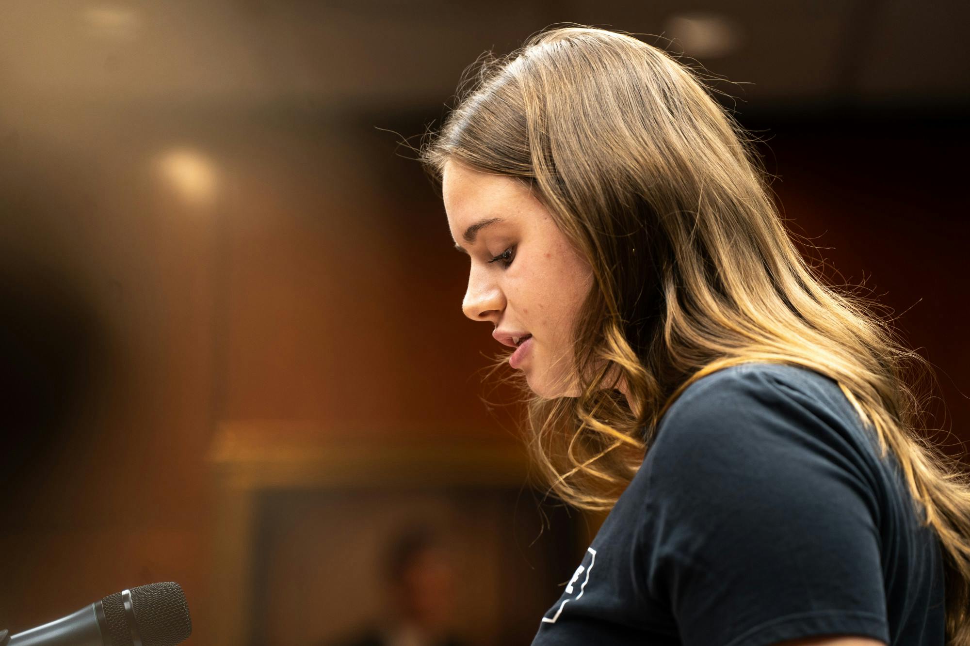 Sophia Balow pushes for the reinstatement of MSU Swim and Dive at the Board of Trustees meeting on Oct. 28, 2022.