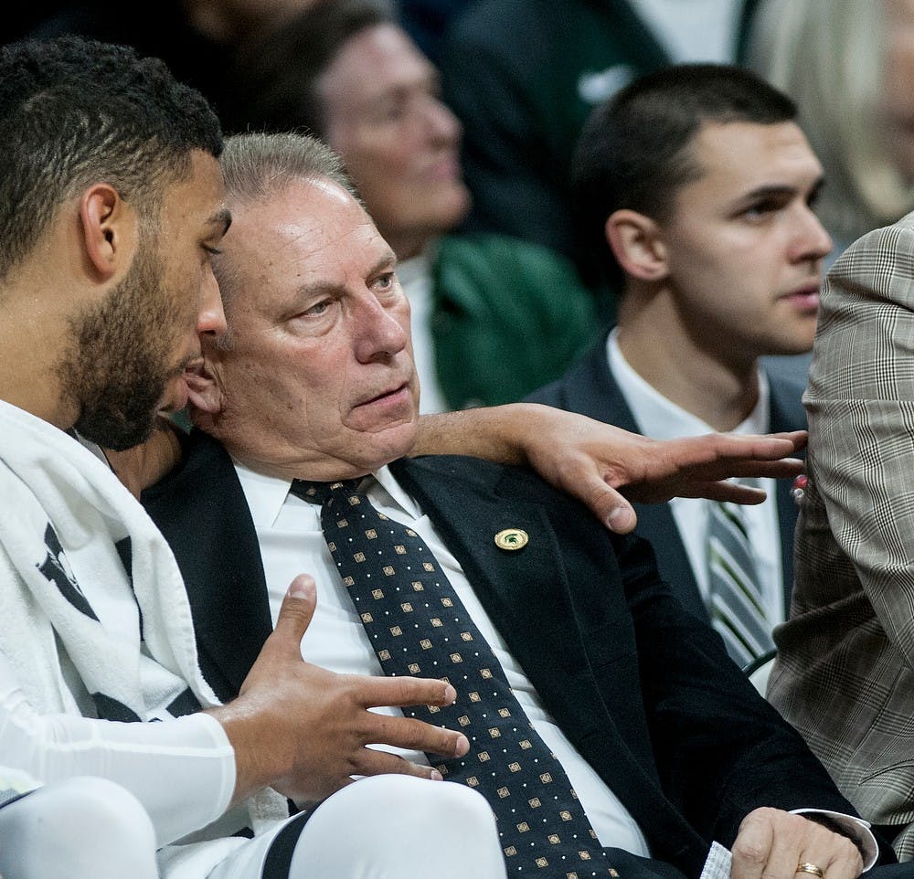 <p>Junior guard Denzel Valentine talks with head coach Tom Izzo during the game against The Master's College on Nov. 3, 2014 at the Breslin Center. The Spartans defeated the Mustangs, 97-56. Aerika Williams/The State News.</p>