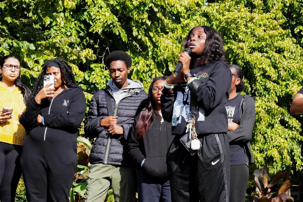 The Black Students Alliance and National Association for the Advancement of Colored People organize a protest of racial injustice outside of the Student Services Building at Michigan State University on Oct. 18, 2023.