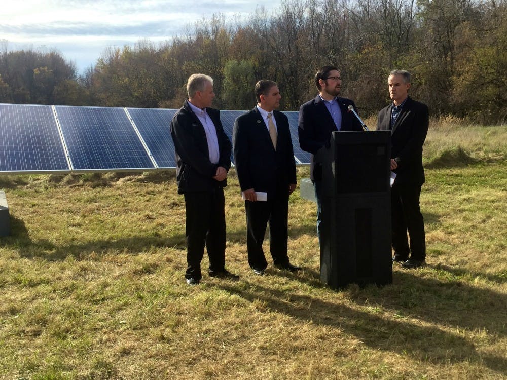 <p>East Lansing Mayor Nathan Triplett speaking on Oct. 27 about a new&nbsp;community solar project at Burcham Park in East Lansing.&nbsp;Left to right:&nbsp;Lansing Board of Water and Light General Manager&nbsp;Dick Peffley, Lansing&nbsp;Mayor Virg Bernero, East Lansing&nbsp;Mayor Nathan Triplett and&nbsp;Michigan Energy Options Executive Director John Kinch</p>