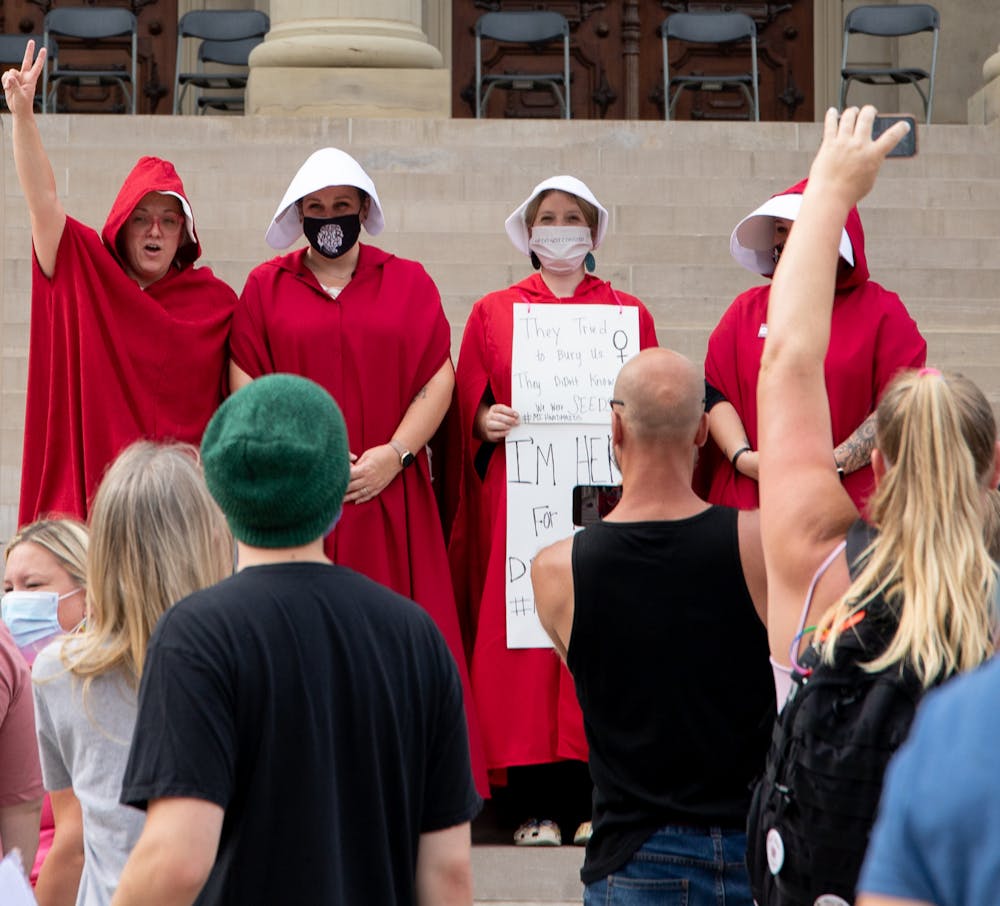 <p>Dressed in costumes of handmaidens from &quot;The Handmaid&#x27;s Tale&quot; marchers stood on the steps of the capitol. Women&#x27;s March Michigan partnered with MI BODY MI CHOICE on Oct. 2, 2021, to host the march. Chants of, &quot;My body, my choice,&quot; could be heard during the march that walked to the capitol building. </p>