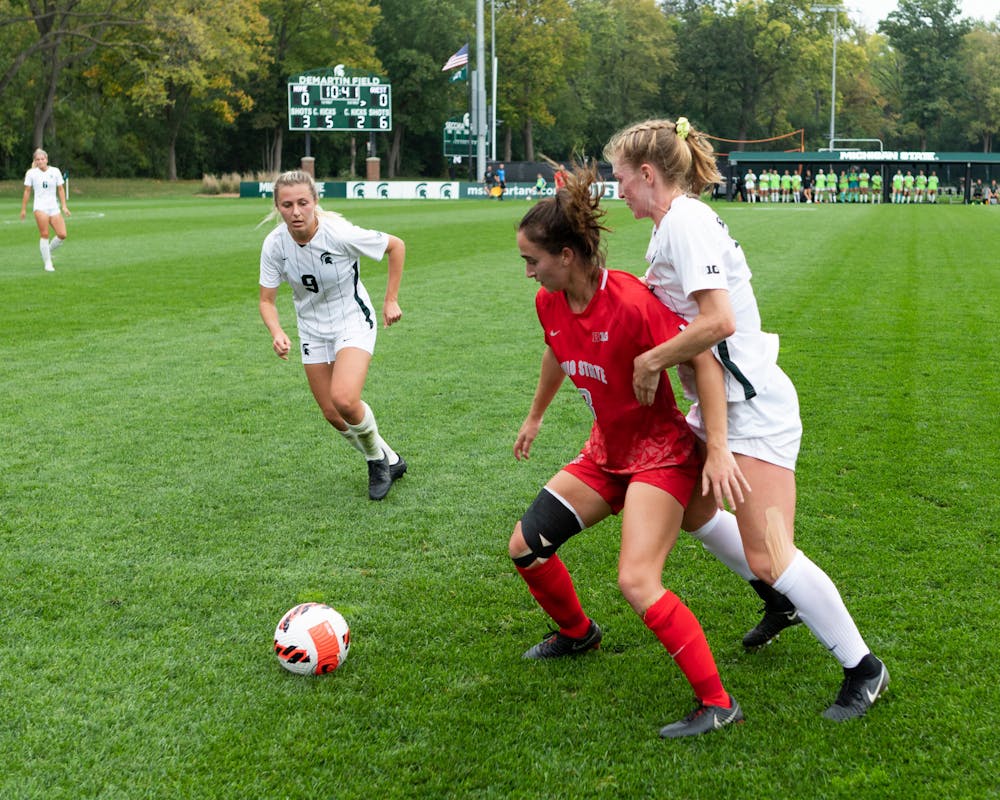 <p>Ohio State&#x27;s junior midfielder Brittany Duncan fighting off Michigan State to regain control of the ball. Shot on Oct. 10, 2021.</p>