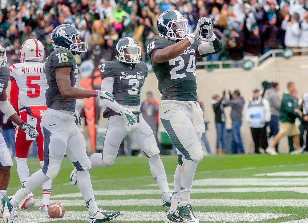 	<p>Junior running back Le&#8217;Veon Bell celebrates by showing the Spartan logo with his gloves after scoring a touchdown Nov. 3, 2012, at Spartan Stadium. Bell rushed for 188 yards and scored two touchdowns during the 28-24 loss to Nebraska. State News File Photo</p>
