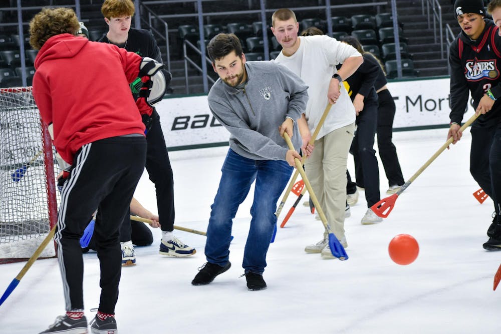 <p>The State News gathered for a chaotic game of broomball against the friendly foe Impact 89FM at Munn Ice Arena on Dec. 2, 2023. This game of broomball involved absolutely no organization, coordination or harmony across the team. Despite this, for the first time in several years, The State News came away with a triumphant win with a score of 5-1. Campus reporter Owen McCarthy and sports reporter Jacob Smith were unofficially named MVPs after unmatched efforts in both defensive and offensive plays. Blood was shed, chants were roared and bellowing laughs were heard across the ice in the monumental game.</p>