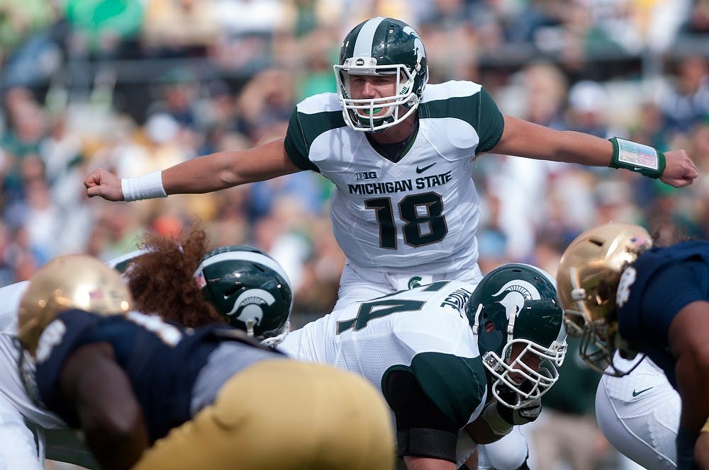 	<p>Sophomore quarterback Connor Cook motions to his team during the game against Notre Dame Sept. 21, 2013, at Notre Dame Stadium in South Bend, Ind. The Fighting Irish defeated the Spartans 17-13. Julia Nagy/The State News</p>