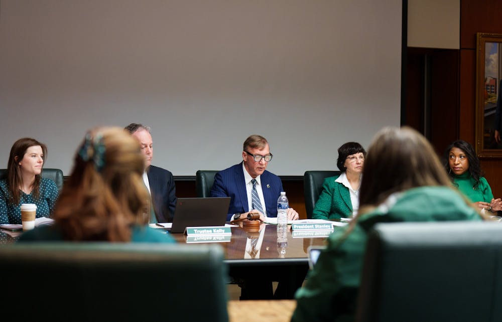 Michigan State President Samuel L. Stanley along side Board of Trustees. The Michigan State University Board of Trustees Meeting with public participation took place in the Hannah Administration Building, on April 22, 2022.