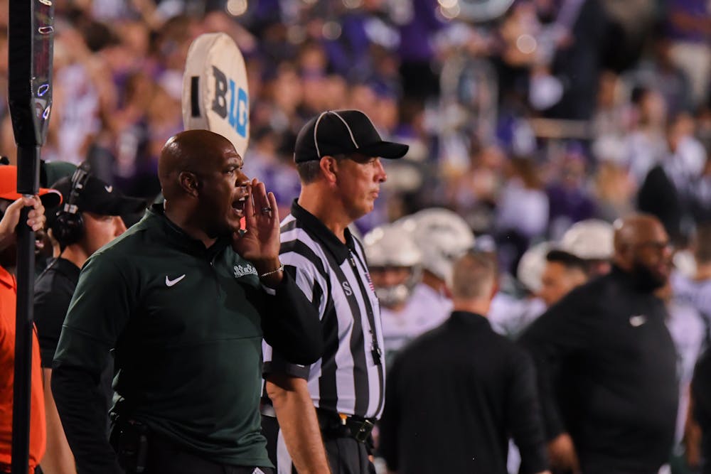 <p>Head coach Mel Tucker yells to players on the field during the Spartans game against Northwestern. Michigan State won the season opener at Ryan Field 38-21, on Sep. 3, 2021.</p>