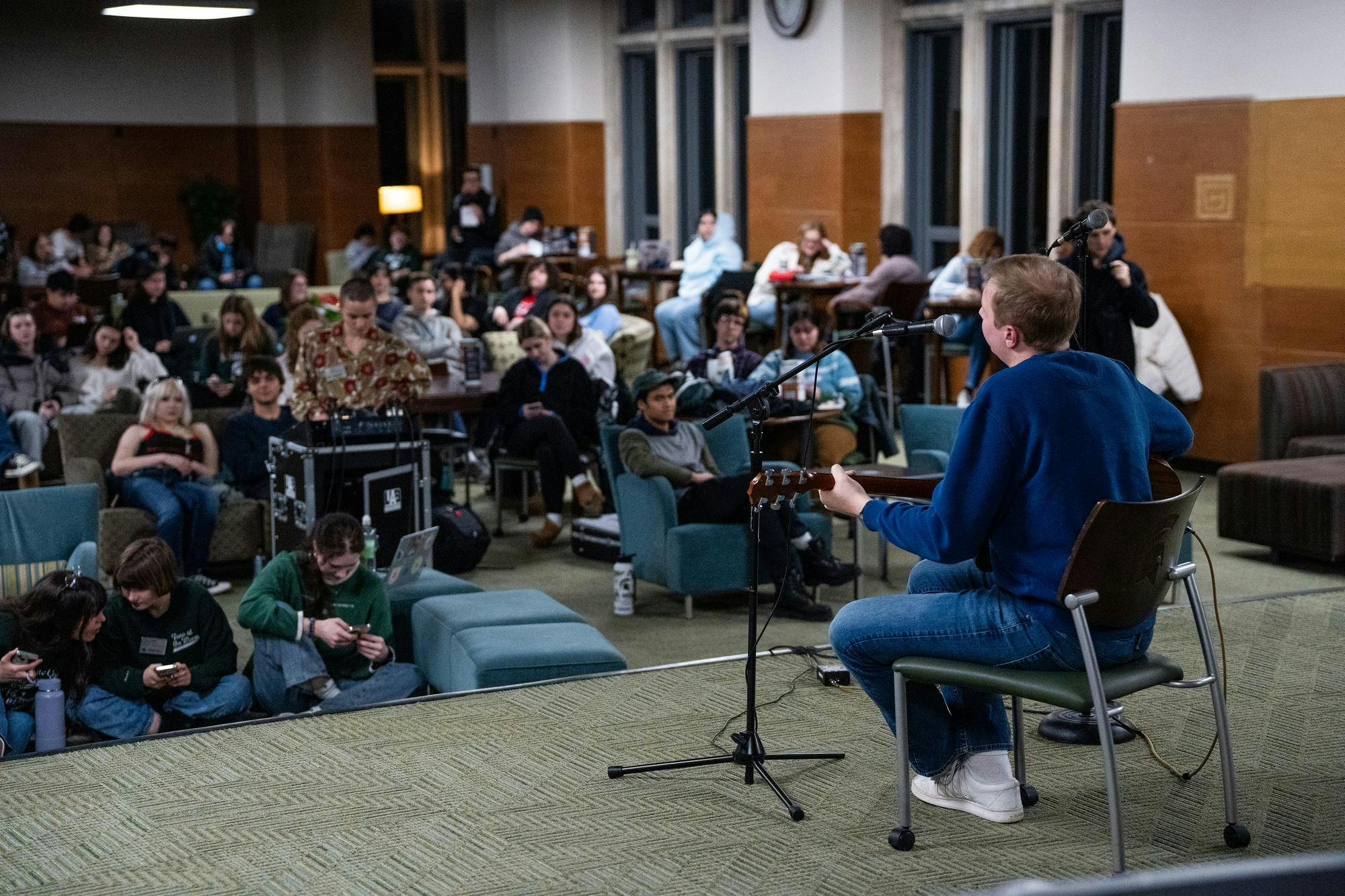 <p>Michigan State Freshman Conner Larsen performs before a crowd at the UAB Open Mic Night at the MSU Union Lounge on Feb. 3rd, 2025</p>