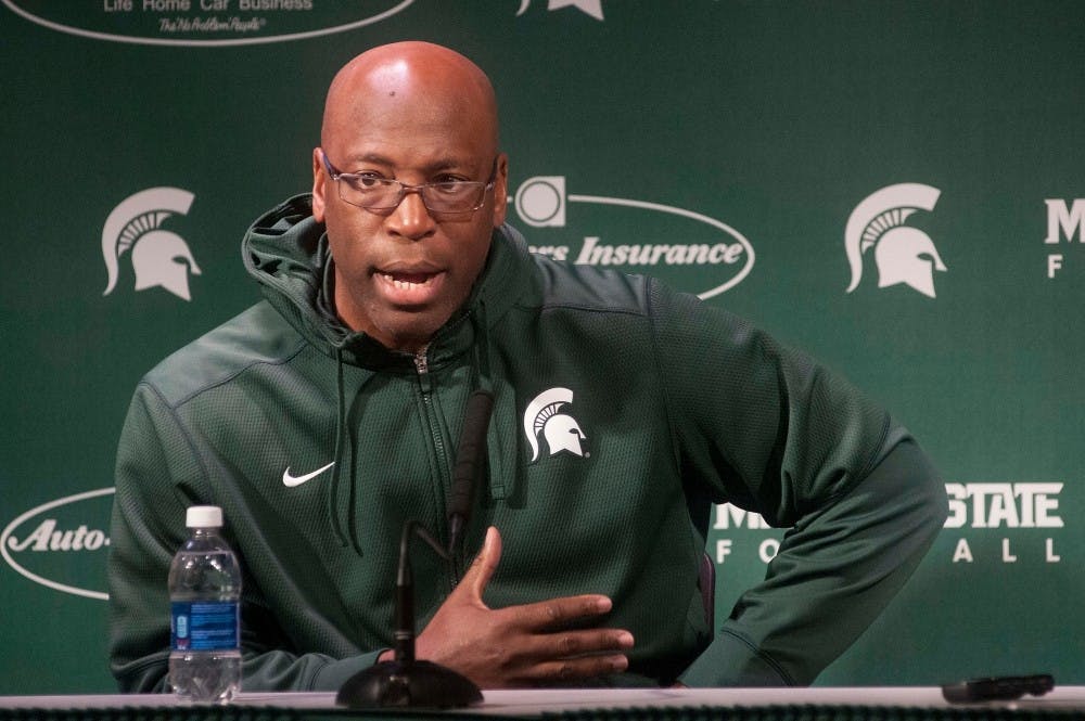 <p>Assistant head coach and co-defensive coordinator Harlon Barnett discusses his history with head coach Mark Dantonio during a press conference on Dec. 16, 2015 at Spartan Stadium. Members of the coaching staff discussed team preparations for the upcoming Cotton Bowl against Alabama. (Alice Cole | The State News)</p>