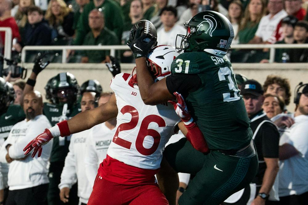<p>Michigan State freshman tight end Jayden Savoury (31) catches a pass over Nebraska fifth-year defensive back Dwayne McDougle III (26) during the Spartans’ game against Nebraska at Spartan Stadium in East Lansing, Mich., on Saturday, Sept. 26, 2026.</p>