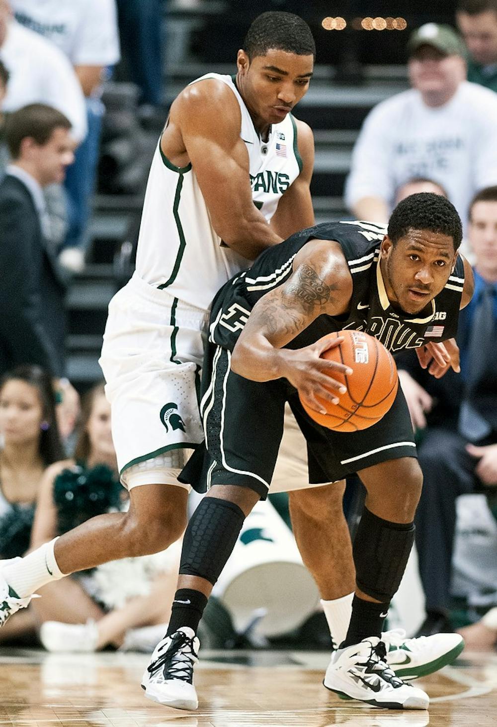 	<p>Freshman guard Gary Harris plays defense on Purdue guard Terone Johnson on Saturday, Jan. 5, 2012, at Breslin Center. <span class="caps">MSU</span> defeated Purdue 84-61 during the Spartans&#8217; Big Ten home opener. Adam Toolin/The State News</p>