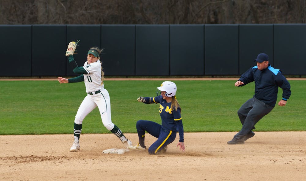 <p>In a very close play Michigan junior Audrey LeClair (25) is called safe on second. Michigan State lost 3-0 to Michigan at the Secchia Stadium, on April 19, 2022.</p>