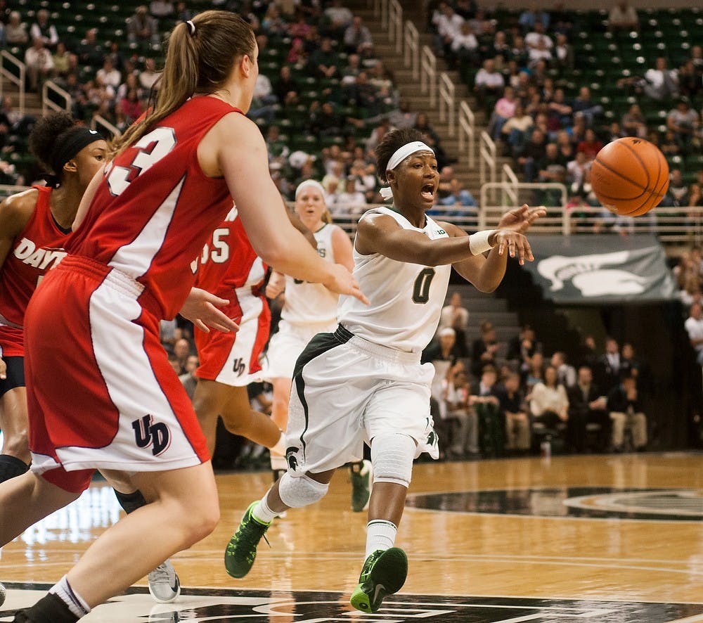 	<p>Junior guard Kiana Johnson passes the ball in the game against Dayton on Nov. 17, 2013, at Breslin Center. <span class="caps">MSU</span> defeated Dayton in overtime, 96-89. Brian Palmer/The State News</p>