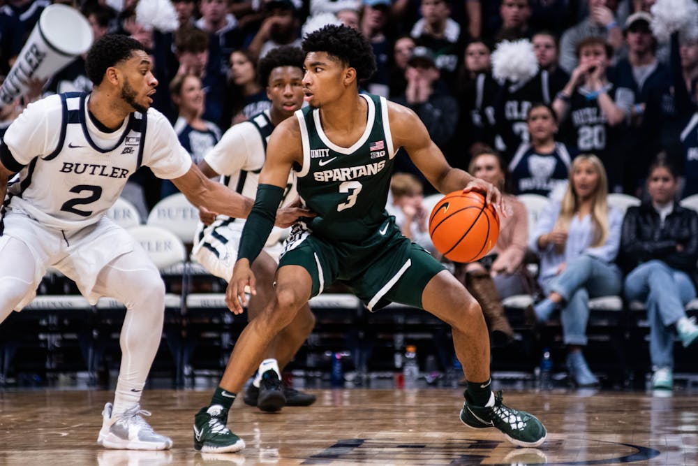 <p>Freshman guard Jaden Akins (3) dribbles the ball during the game against Butler on Nov. 17, 2021, at the Hinkler Fieldhouse. The Spartans defeated the Bulldogs 73-52. </p>