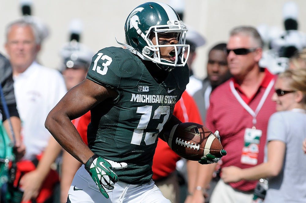 	<p>Senior wide receiver Bennie Fowler gets hyped up after making a catch Sept. 14, 2013 at Spartan Stadium. The Spartans had a strong showing against Youngstown State in a 55-17 victory. Khoa Nguyen/ The State News</p>