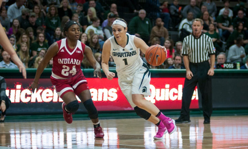 Senior guard Tori Jankoska dives past Indiana Guard Tyshee Towner during the women's basketball game against Indiana on Feb. 2 2017 at Breslin Center. The Spartans defeated the Hoosiers 69-60.