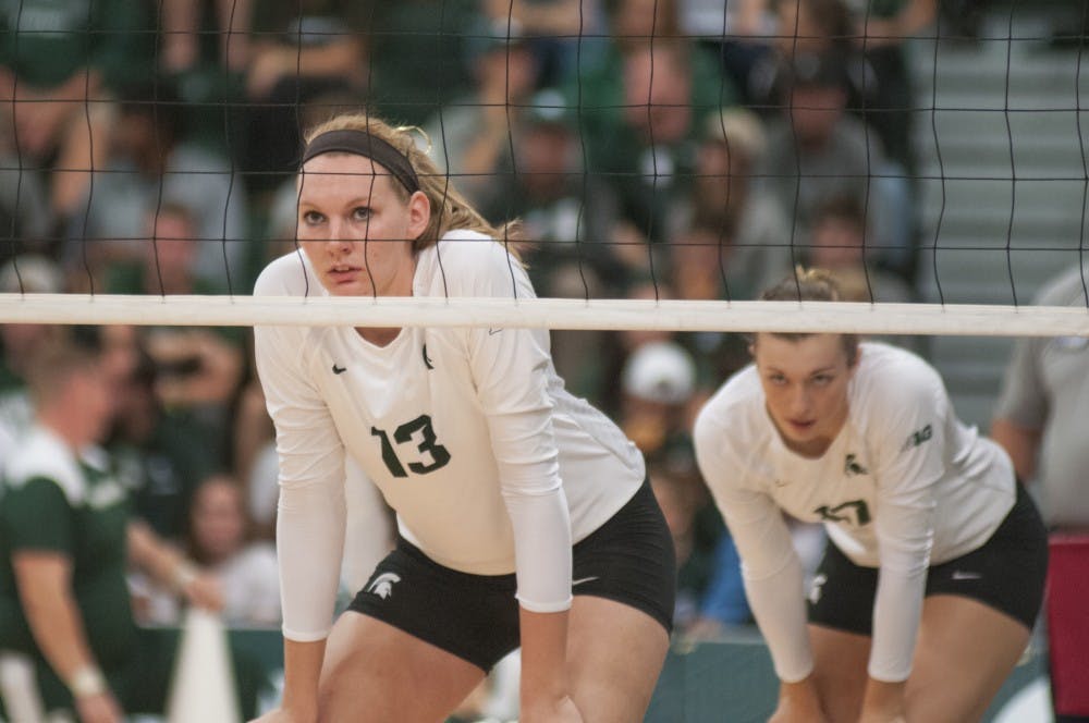 From left, redshirt  junior outside hitter Brooke Kranda (13) and junior mobile blocker Alyssa Grvelink (17) wait for a serve during the game against Nebraska on Sept. 24, 2016 at Jenison Field House. The Spartans were defeated by the Corn Huskers 3-2.