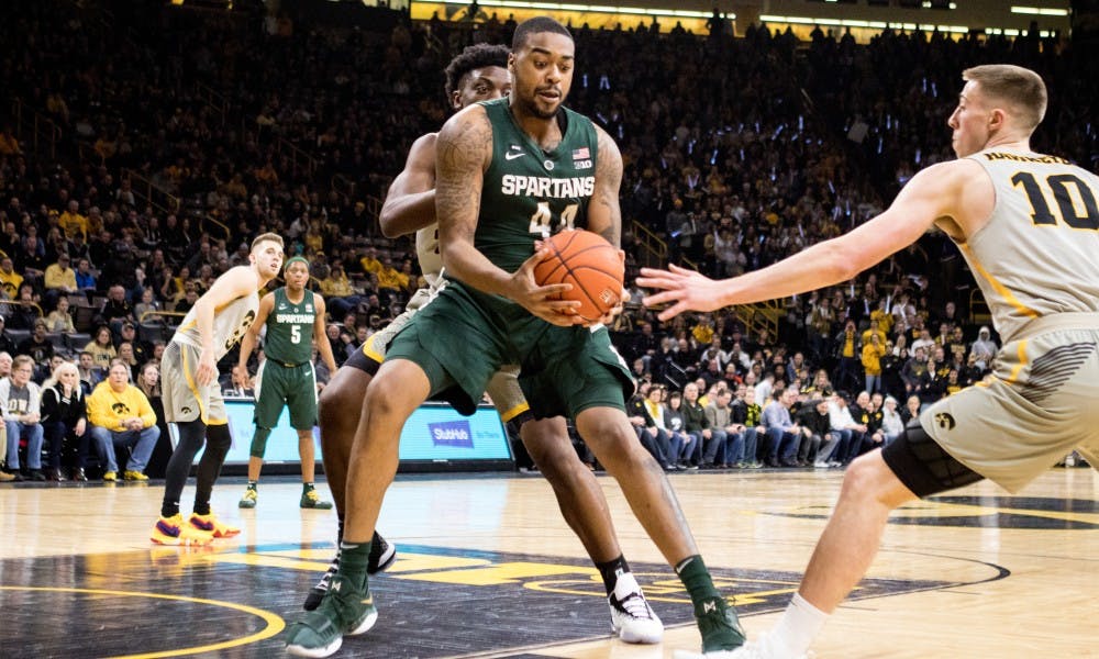 Junior forward Nick Ward (44) handles the ball during the game against Iowa at Carver-Hawkeye Arena on Jan. 24, 2019. The Spartans defeated the Hawkeyes, 82-67.