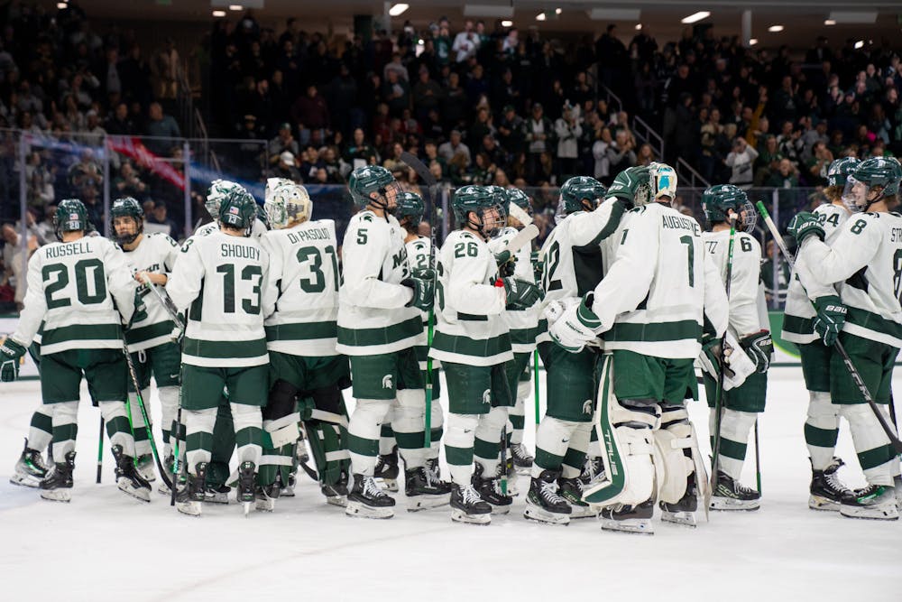 The Spartan players celebrate a 5-2 win against Ohio State University at Munn Ice Arena on Feb. 24, 2024. 