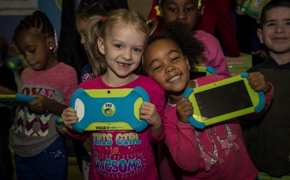 Lansing students show off the tablets they received through the Playtime Pad Research Project. Photo courtesy of Amanda Pinckney/WKAR-MSU.