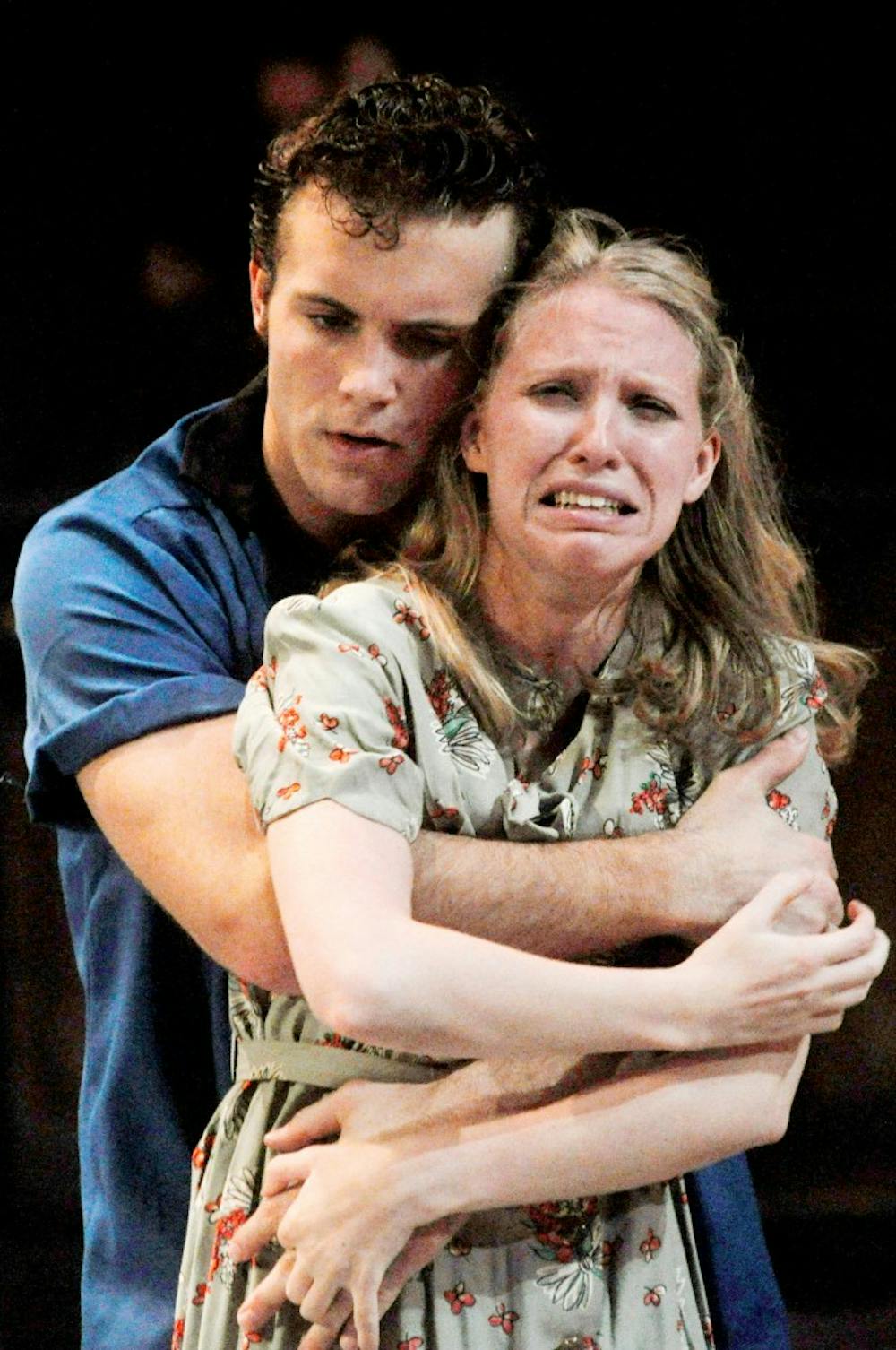Theater senior and MSU wrestler Curran Jacobs hugs assistant professor of acting and voice Christina Traister Tuesday evening at the rehearsal of a "A Streetcar Named Desire." Jacobs, was cast as Stanley in the production put on by the MSU Department of Theater. Justin Wan/The State News