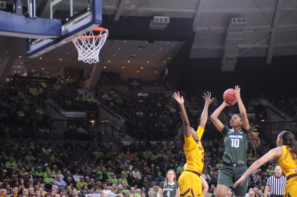 <p>Sophomore forward Sidney Cooks shoots the ball over Central Michigan defender during a CAAW Tournament game in South Bend, Indiana on March 23, 2019. MSU defeated CMU 88-87 and advanced to the Round of 32 with the victory.</p>