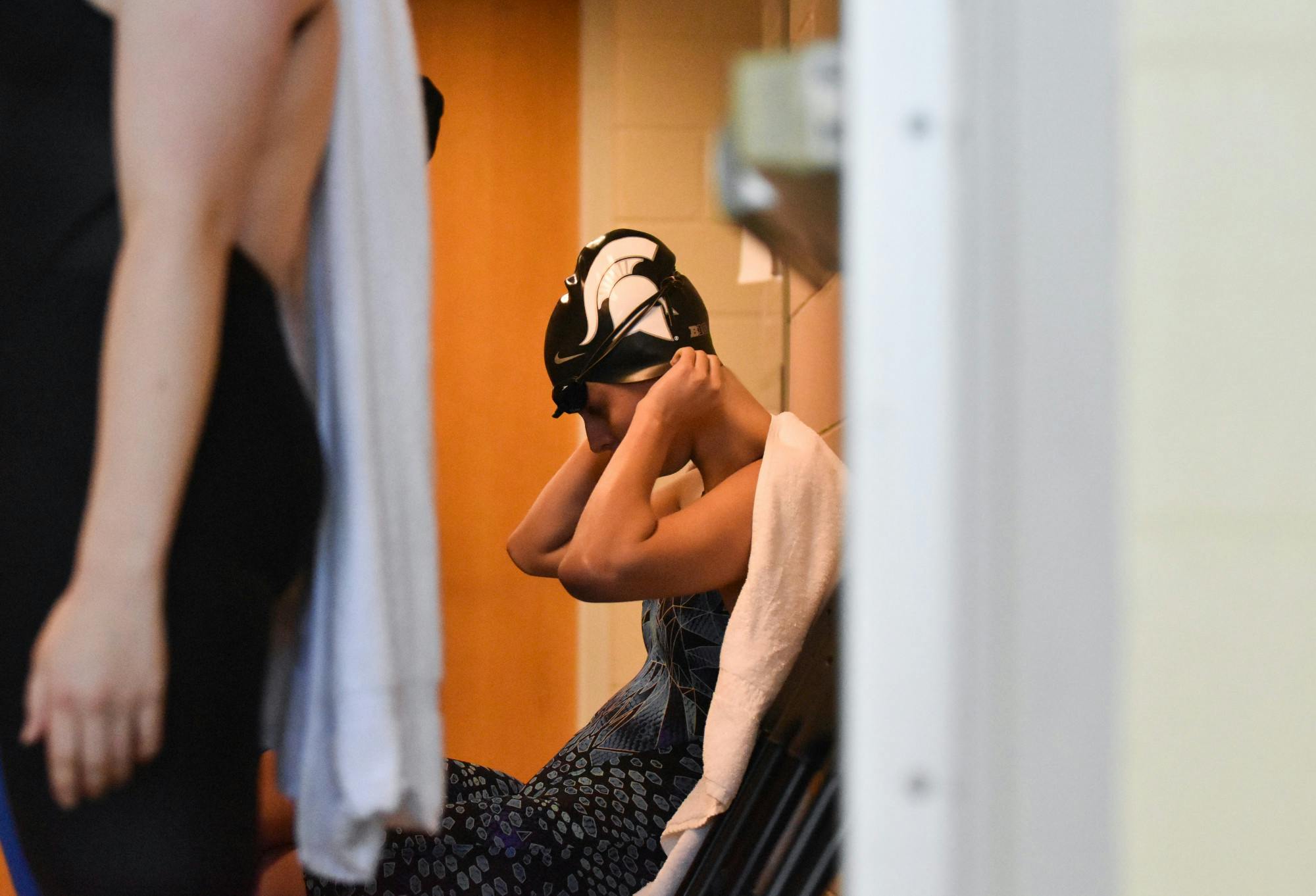<p>Junior breaststroker Kasey Venn prepares herself for the 100 Yard IM in the ready room during CCS Nationals at McAuley Aquatic Center in Atlanta, Georgia on April 10, 2022. Venn won the event with a time of 58.07. </p>
